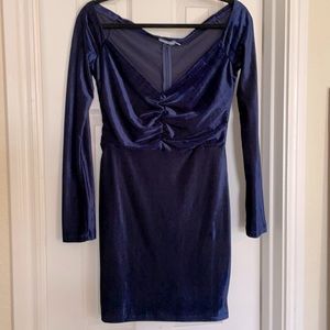 Long sleeve velvet fitted dress. Low cut.